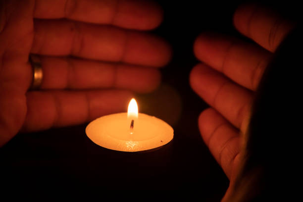 istock protect the candle from extinguishing. 1448518394