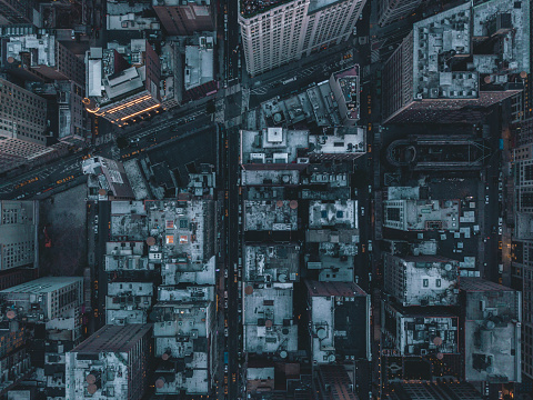 Aerial Overhead View of Manhattan, New York City Streets right after dusk with street lights HQ