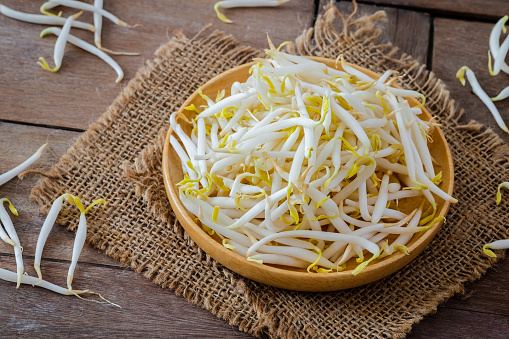 Bean sprouts on wooden plate