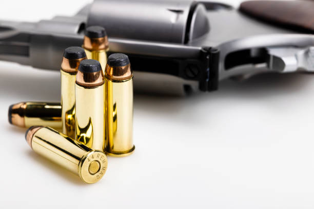 istock .44 magnum bullets with revolver hand gun background 1448522872
