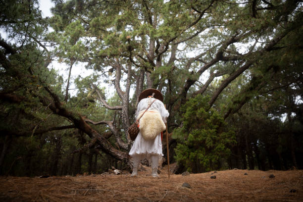 istock shugendo monk standing and praying in front of large pine tree 1448524164