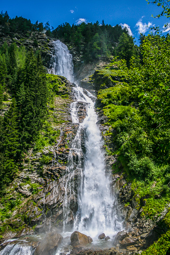 istock Image of high waterfall during the day 1448526352