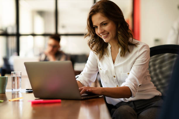 istock Young woman working on laptop. 1448526777