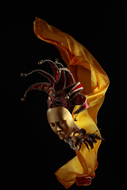 istock Old carnival masks with flutters yellow cloth. 1448527685