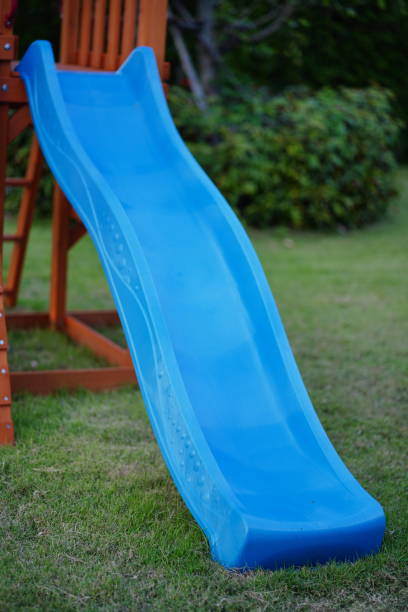 istock Blue slide in garden 1448528698