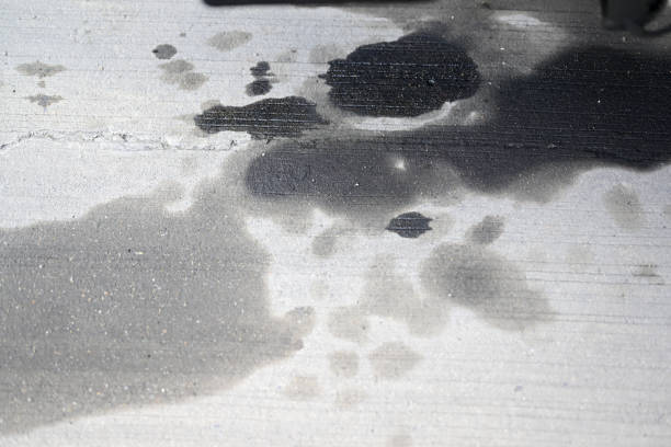 Stains of engine oil from car on cement floor at container yard