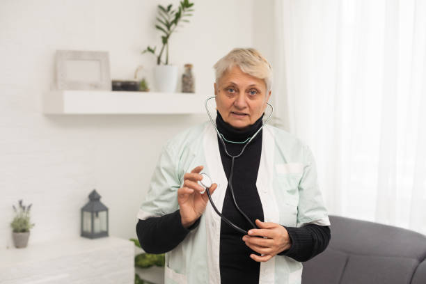 istock an elderly woman doctor, nurse 1448529834