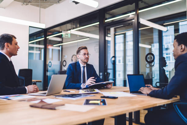 istock Group of young people talking in office 1448530249