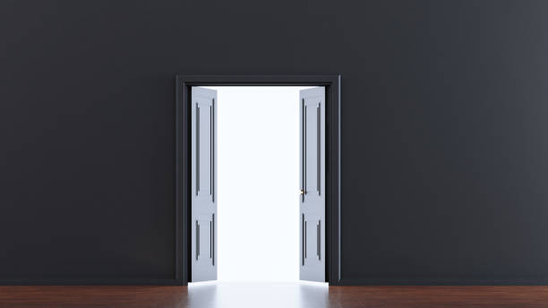 istock Open door with light going through in dark grey room, 1448532320