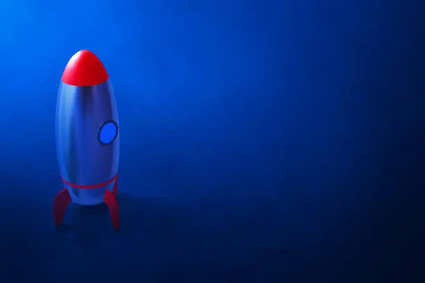 Photo of Rocket 3d illustration on blue background