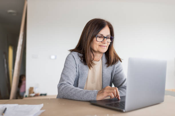 istock Senior woman during home renovation 1448534653