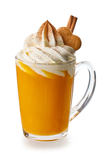 pumpkin Christmas latte drink decorated with whipped cream, cinnamon and gingerbread isolated on white background