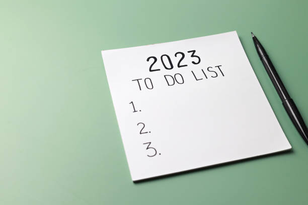 To do list text on note pad on green background. stock photo