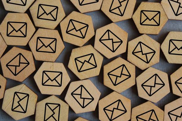 Top view image of wooden cubes with mail icon. Top view image of wooden cubes with mail icon. Junk email, spam mail and email overload concept phone spam photos stock pictures, royalty-free photos & images
