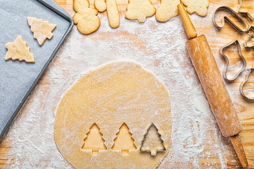 Fresh baked Christmas cookies in Christmas style. Shortbread cookies in the shape of stars. View with copy space