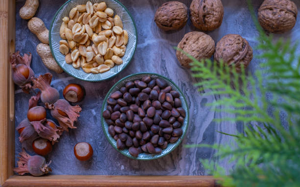 istock Walnuts, peanuts, hazelnut, pine nuts. Healthy super food 1448538210
