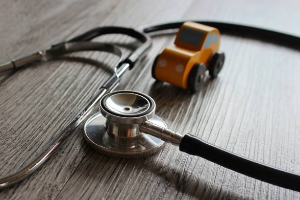 istock Toy car and stethoscope. 1448538216