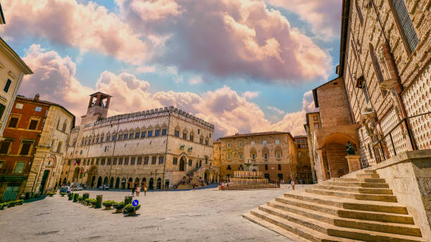 An idyllic sky envelops the main square and the Palazzo Dei Priori in the medieval heart of Perugia in Umbria stock photo