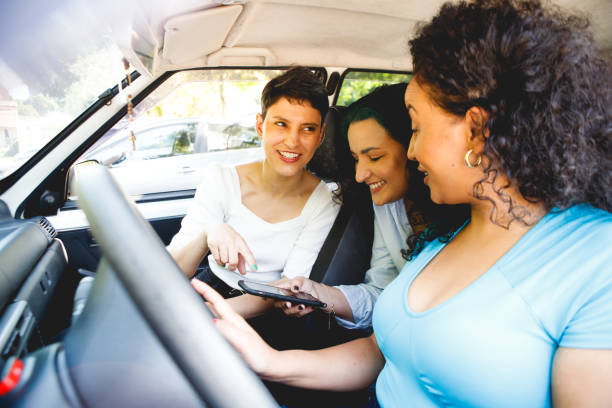 istock female friends in a car going for a ride 1448538990