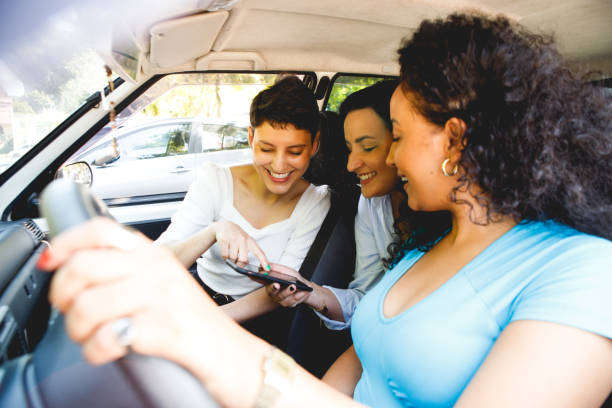 istock female friends in a car going for a ride 1448538993