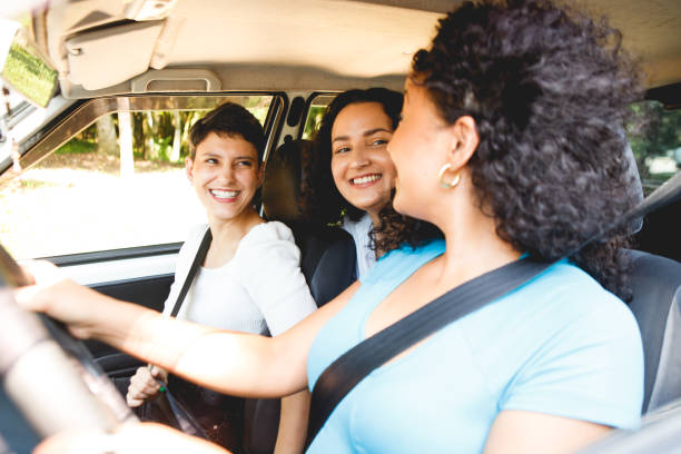 istock female friends in a car going for a ride 1448539021