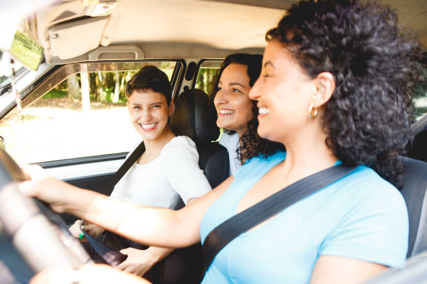 istock female friends in a car going for a ride 1448539032
