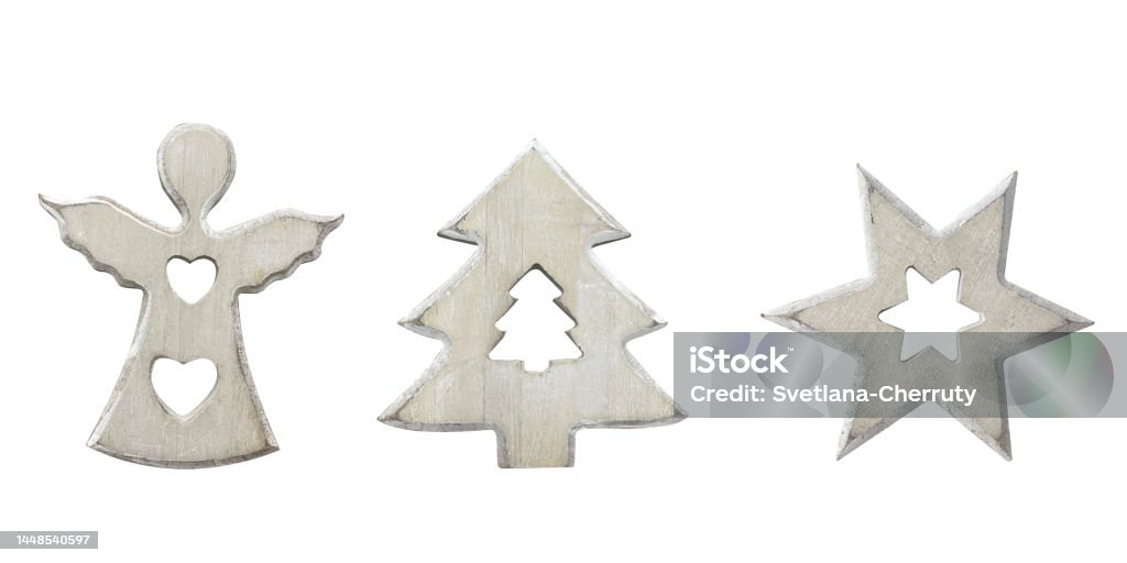 Christmas wooden toys isolated on white background. Christmas wooden toys angel, star and Xmas tree in shabby chic style isolated on white background. Holiday reusable eco friendly decorations. Abstract Stock Photo