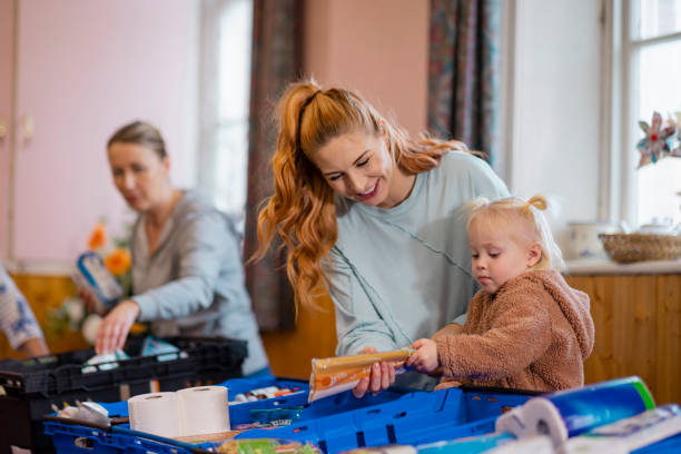 istock Young Mum at a Food Bank 1448547280