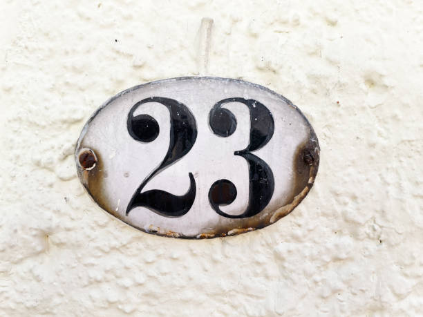 istock 23 - house number plaque twenty-three on wall 1448547463