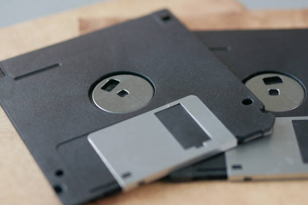 istock an old vintage floppy disk on a gray background. 1448548101