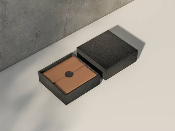 istock Two Square Black Boxes Mockup with golden wrapping paper on white table 1448551868