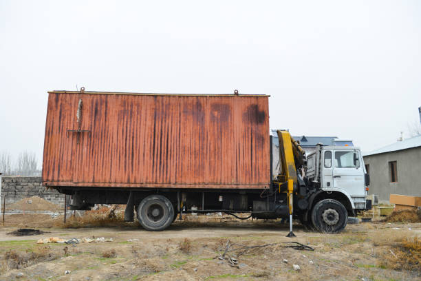 istock Truck with crane manipulator loads a container. 1448551909
