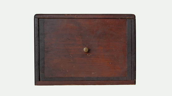 Small old wooden drawer isolated on a white background