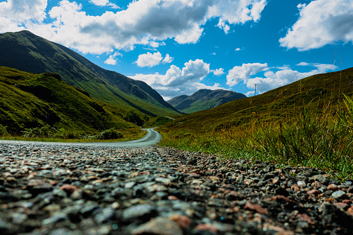 An aerial panorama of the road following the River Etive near to Glencoe, Scotland on a summers day