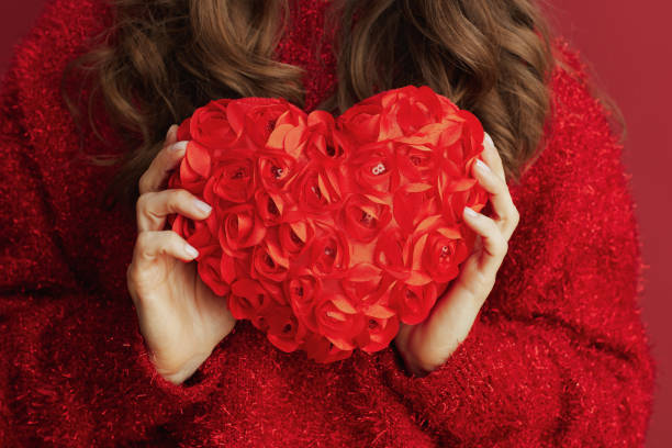 istock Closeup on woman with red heart 1448557845