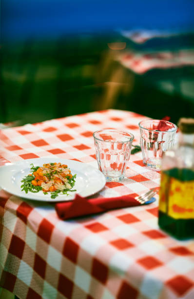 istock Gnocchi with pomodoro (tomato sauce) and rocket salad. 1448558118