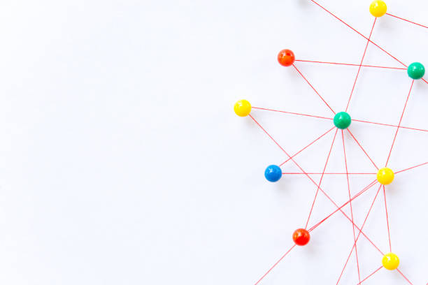 istock Linking entities, Blockchain, social media, Communications Network, The connection between the two networks. Network simulation on paper linked together by yarn 1448558421