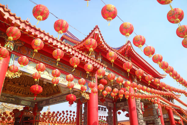 istock Chinese Buddhist Temple Decorated with Chinese New Year Hanging Lanterns in Numerous Rows 1448558522
