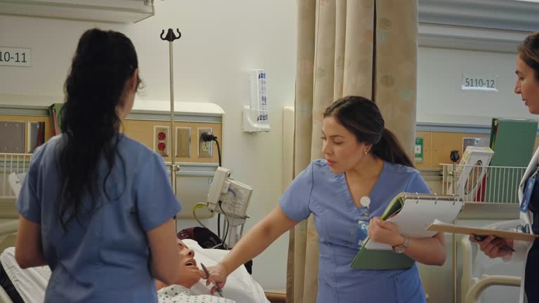 Medical student examines mannequin during training exercise