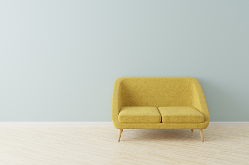Yellow sofa in Scandinavian style in front of an empty wall. 3D rendered mock-up.