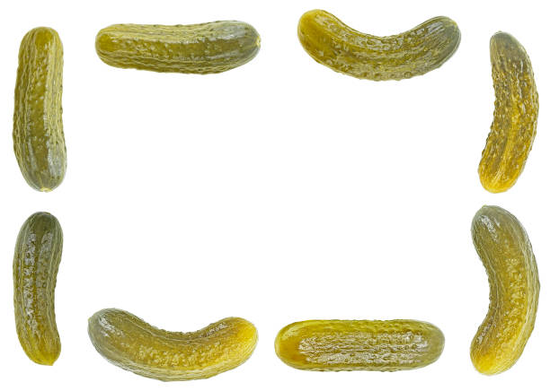 istock Frame from fresh pickled cucumbers isolated on a white background. Gherkins. 1448560680