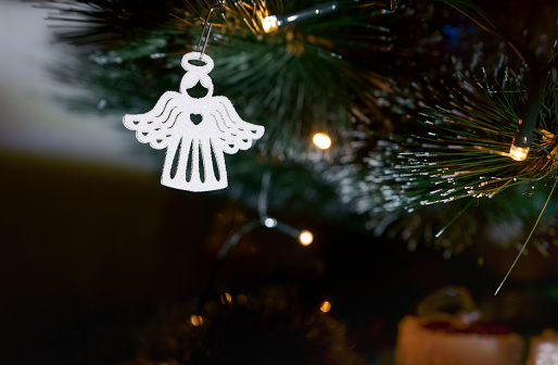 Christmas decoration white angel on a dark background