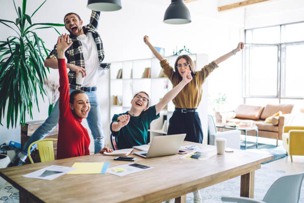 istock Cheerful students celebrating success 1448566107