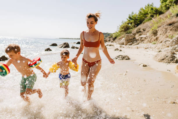 istock With mommy at the wild beach 1448567817