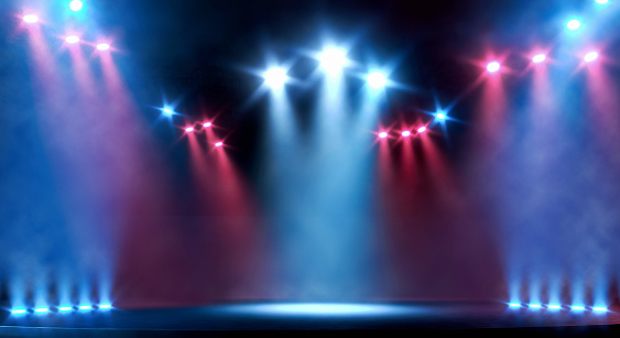 Empty concert stage illuminated by bright spotlights, with no people. Red and blue shining lights with dark surroundings and some smoke effect. Theatre or music venue scene with visible stage's edge and copy space. Digitally generated image.