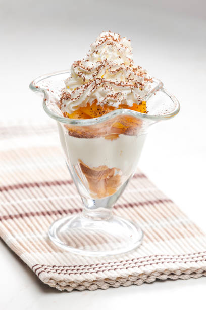istock ice cream with stewed peach and whipped cream 1448568794