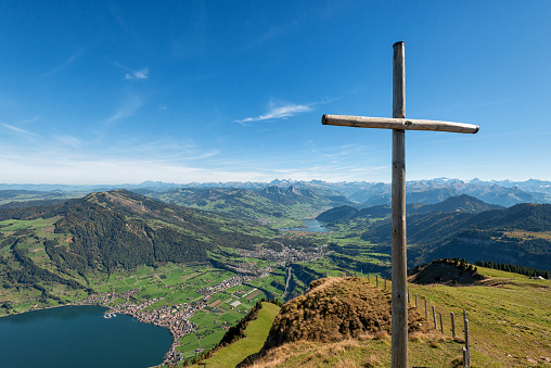 Cross on the top of Mount Rigi with breathtaking views over the Swiss Alps