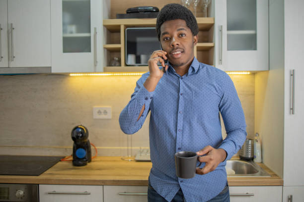 istock Portrait of a young man using smartphone 1448572161