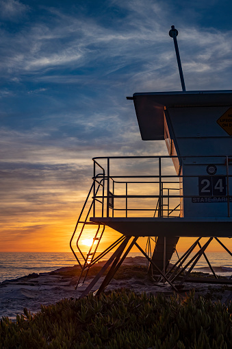 Lifeguard Tower at Sunset at Rock Jetty at Ponto Beach in Carlsbad, San Diego, California.