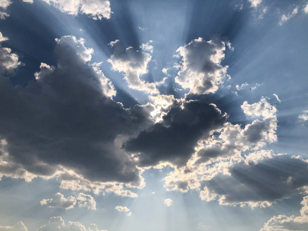 istock The rays of the sun break through the cumulus clouds. 1448577073